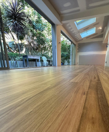 Floor view of the outdoor patio with elegant design ceeling with trees and plants viewed outside
